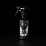 Happy Spell 250ml linen and fabric spray by Apollo Ipsum on a black studio background