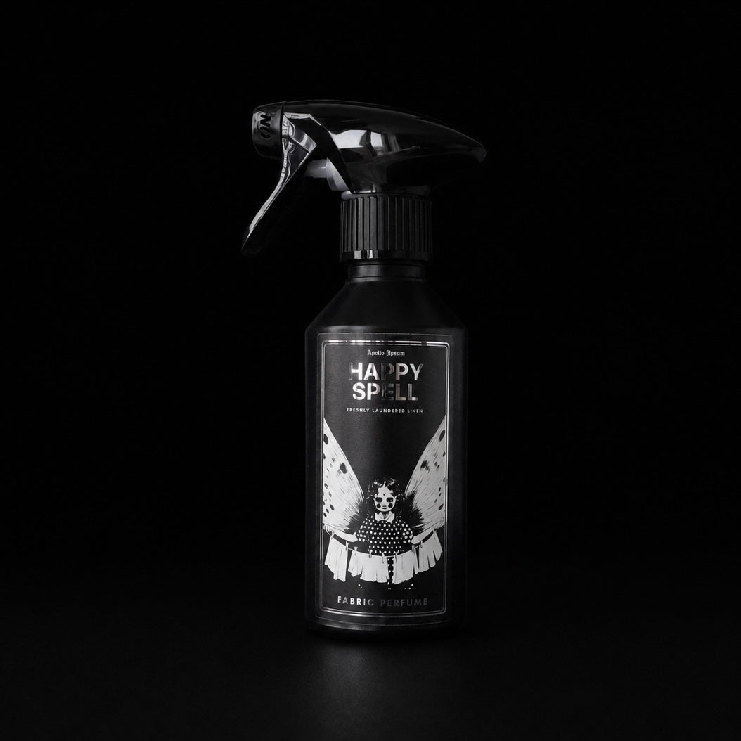 Happy Spell 250ml linen and fabric spray by Apollo Ipsum on a black studio background