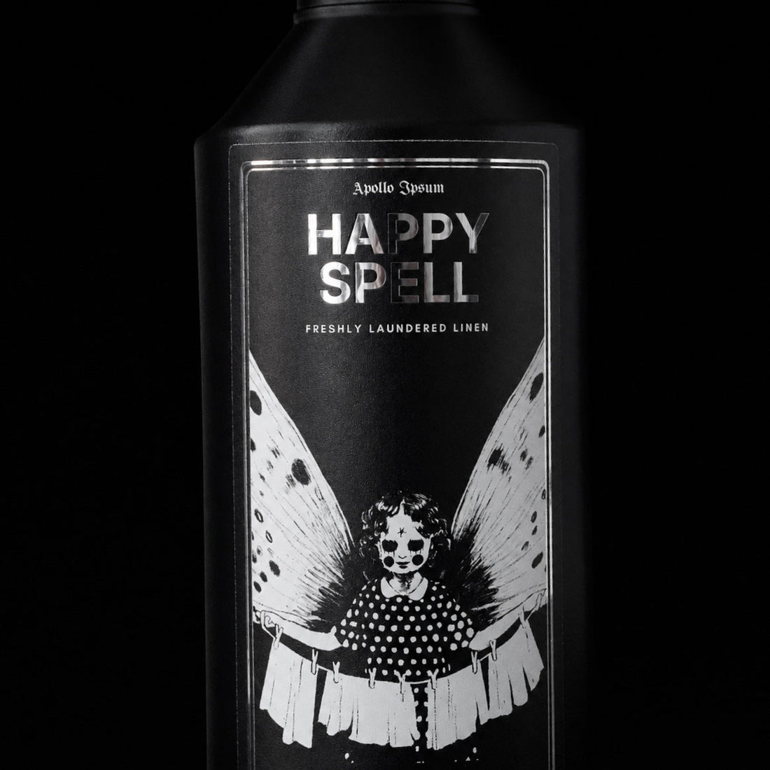 Close-up of the Happy Spell Fabric Perfume label on a fresh linen home fragrance spray