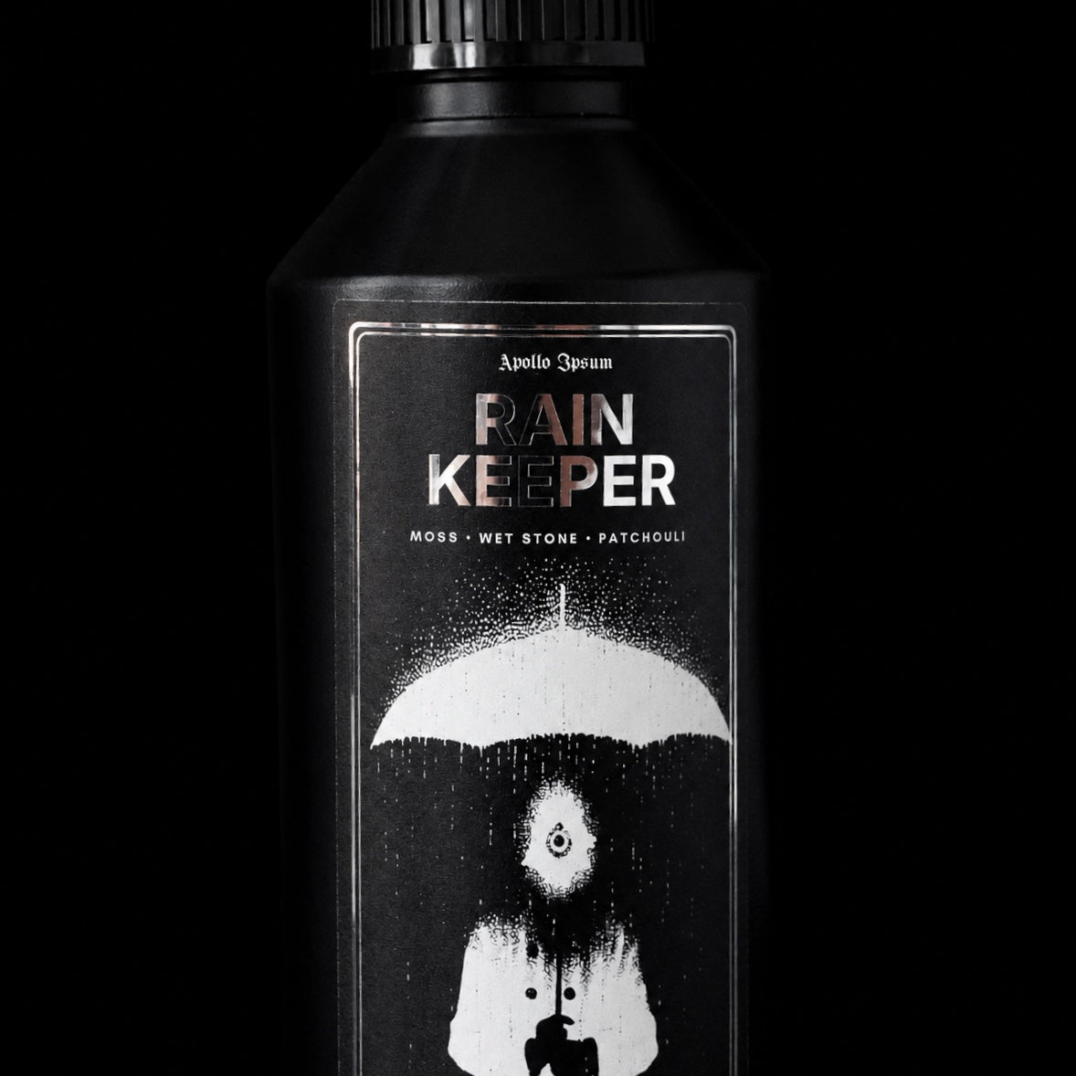 Close-up of the Rain Keeper Fabric Perfume label on an earthy home fragrance spray