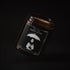 Rainkeeper soy wax candle in an amber jar with illustrated label, Apollo Ipsum Things That Shouldn&
