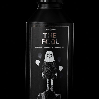 Close-up of The Fool Fabric Perfume label on a spiced home fragrance spray