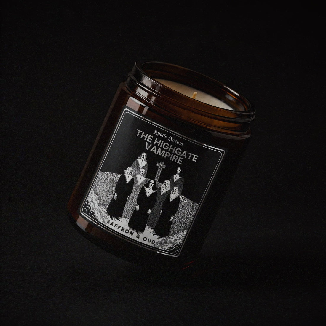 The Highgate Vampire soy wax candle in an amber jar with illustrated label, Apollo Ipsum Things That Shouldn&