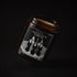 The Highgate Vampire soy wax candle in an amber jar with illustrated label, Apollo Ipsum Things That Shouldn&