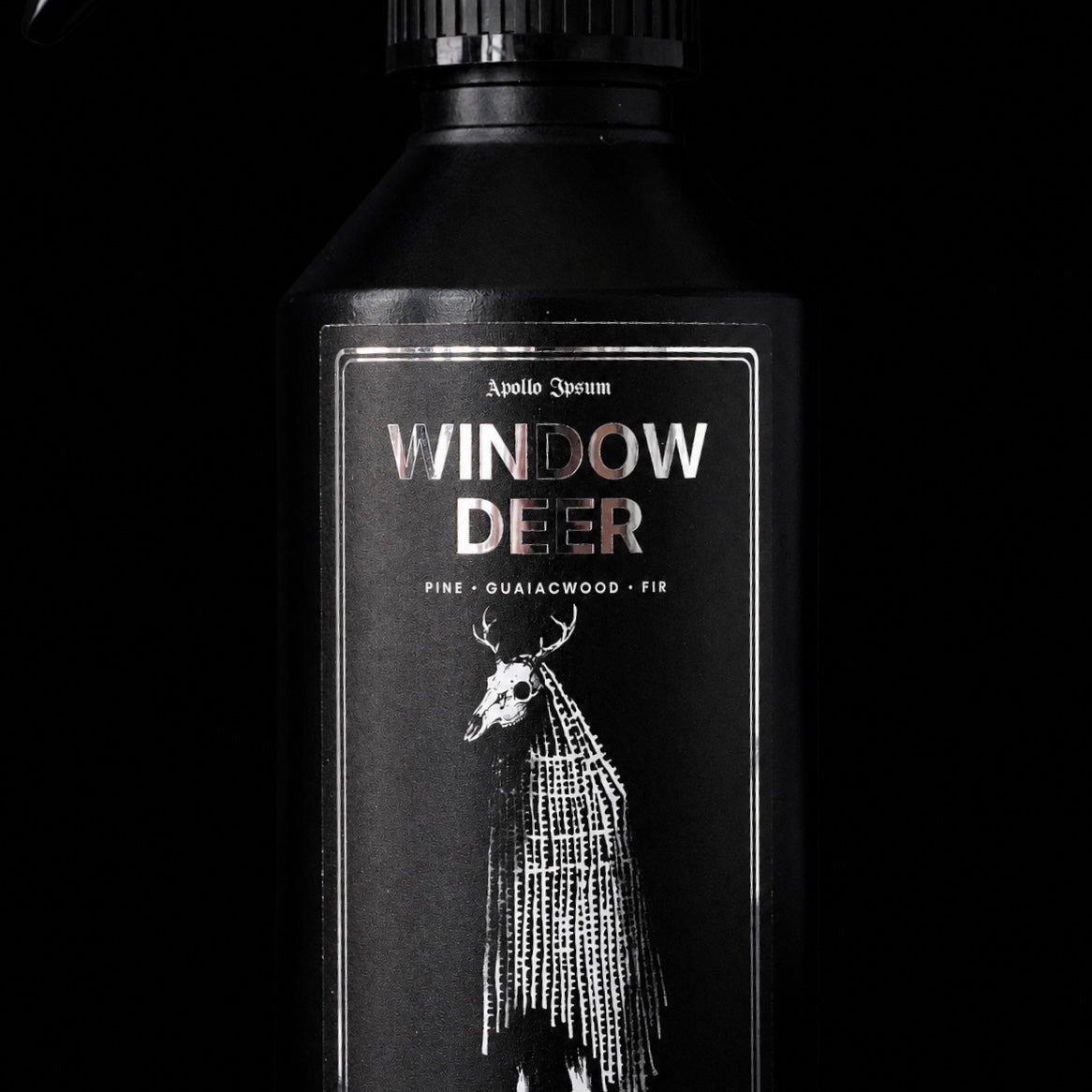 Close-up of the Window Deer Fabric Perfume label on a woody home fragrance spray