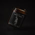 Window Deer soy wax candle in an amber jar with illustrated label, Apollo Ipsum Things That Shouldn&