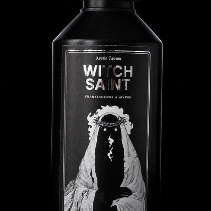Close-up of the Witch Saint Fabric Perfume label on a frankincense home fragrance spray