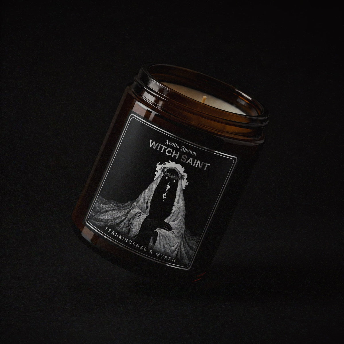 Witch Saint soy wax candle in an amber jar with illustrated label, Apollo Ipsum Things That Shouldn&